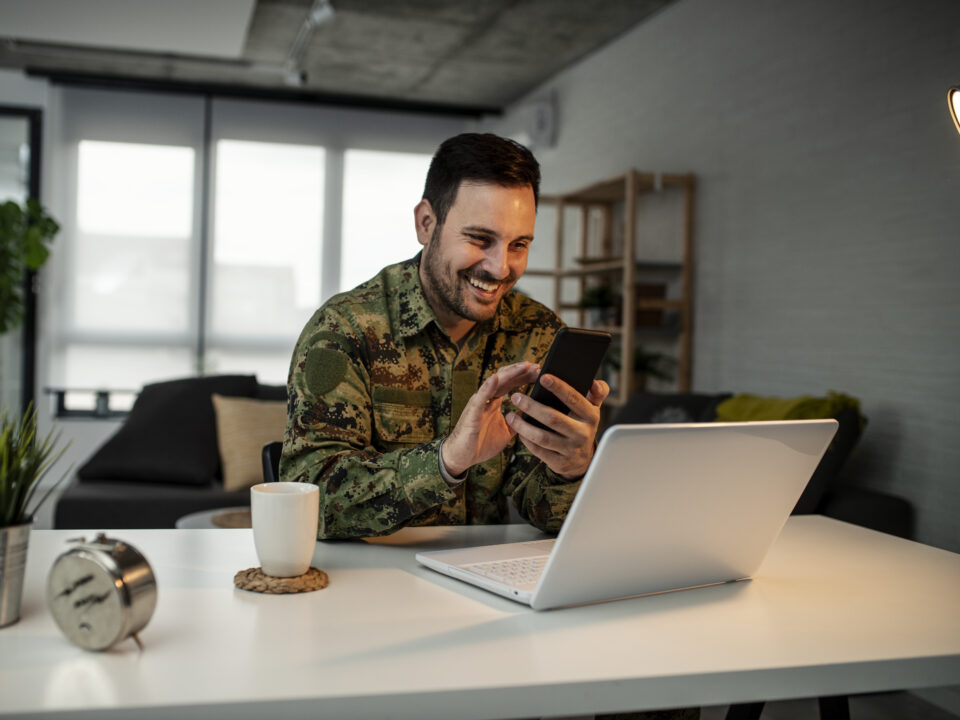 Army man with smart phone